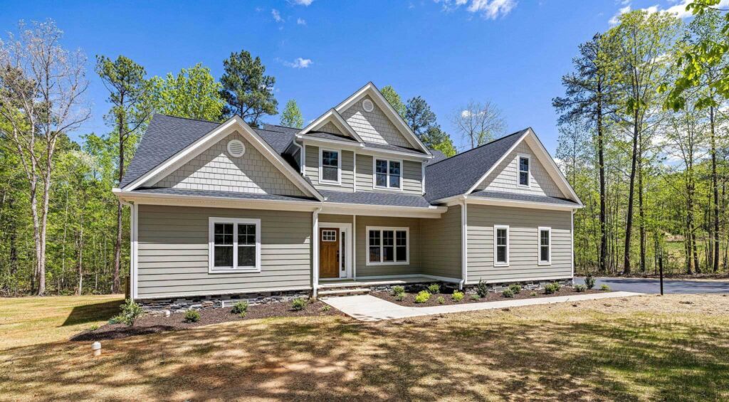 The Augusta, a Ridout custom home with a wide front porch on an open lot in Maple Grove, Powhatan