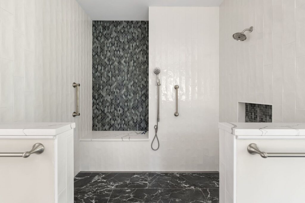 Primary bath with a tiled walk-in shower in The Palmer