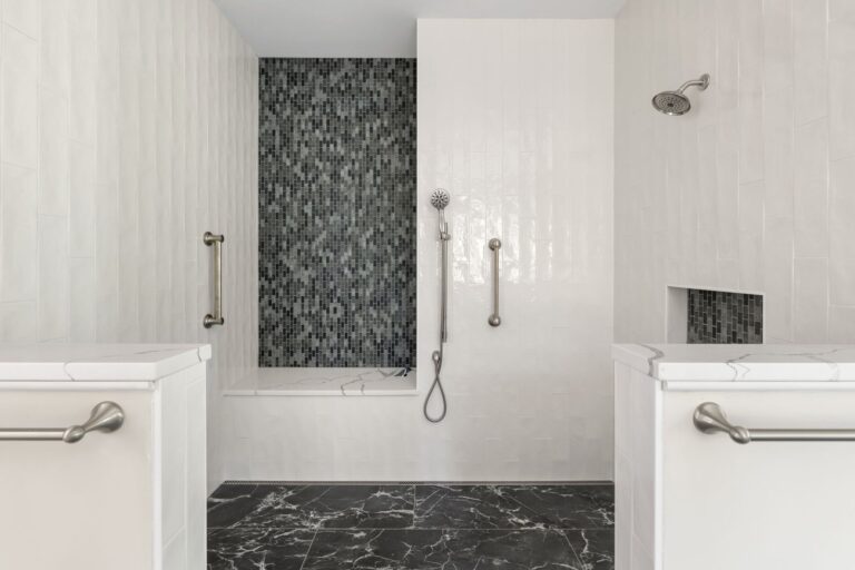 Primary bath with a tiled walk-in shower in The Palmer