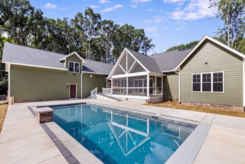 Backyard with an in-ground pool and patio behind The Palmer in Powhatan