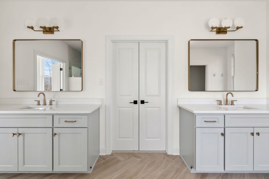 Primary bath with a double vanity and a freestanding tub in The Scheffler