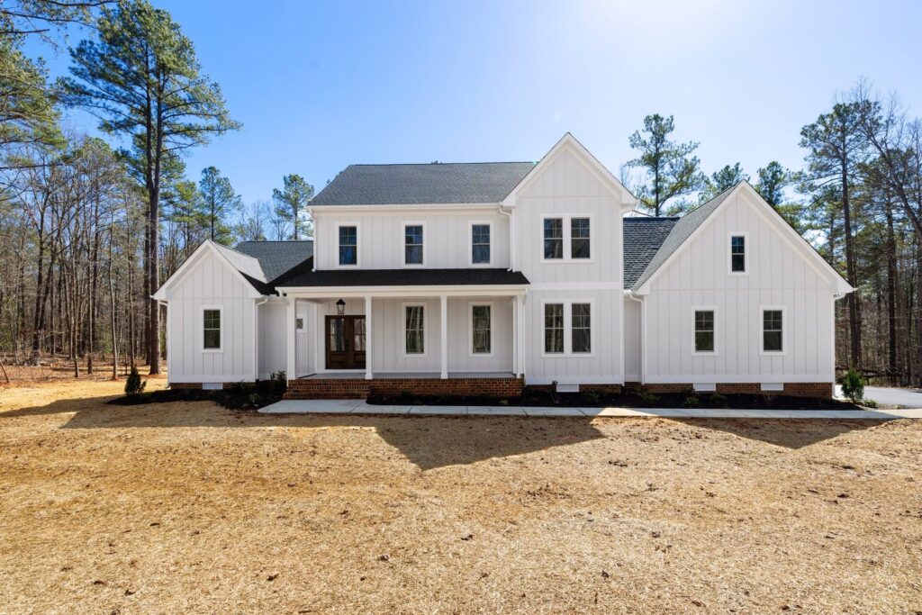 The Scheffler, a white modern farmhouse with black windows built by Ridout Construction in Powhatan